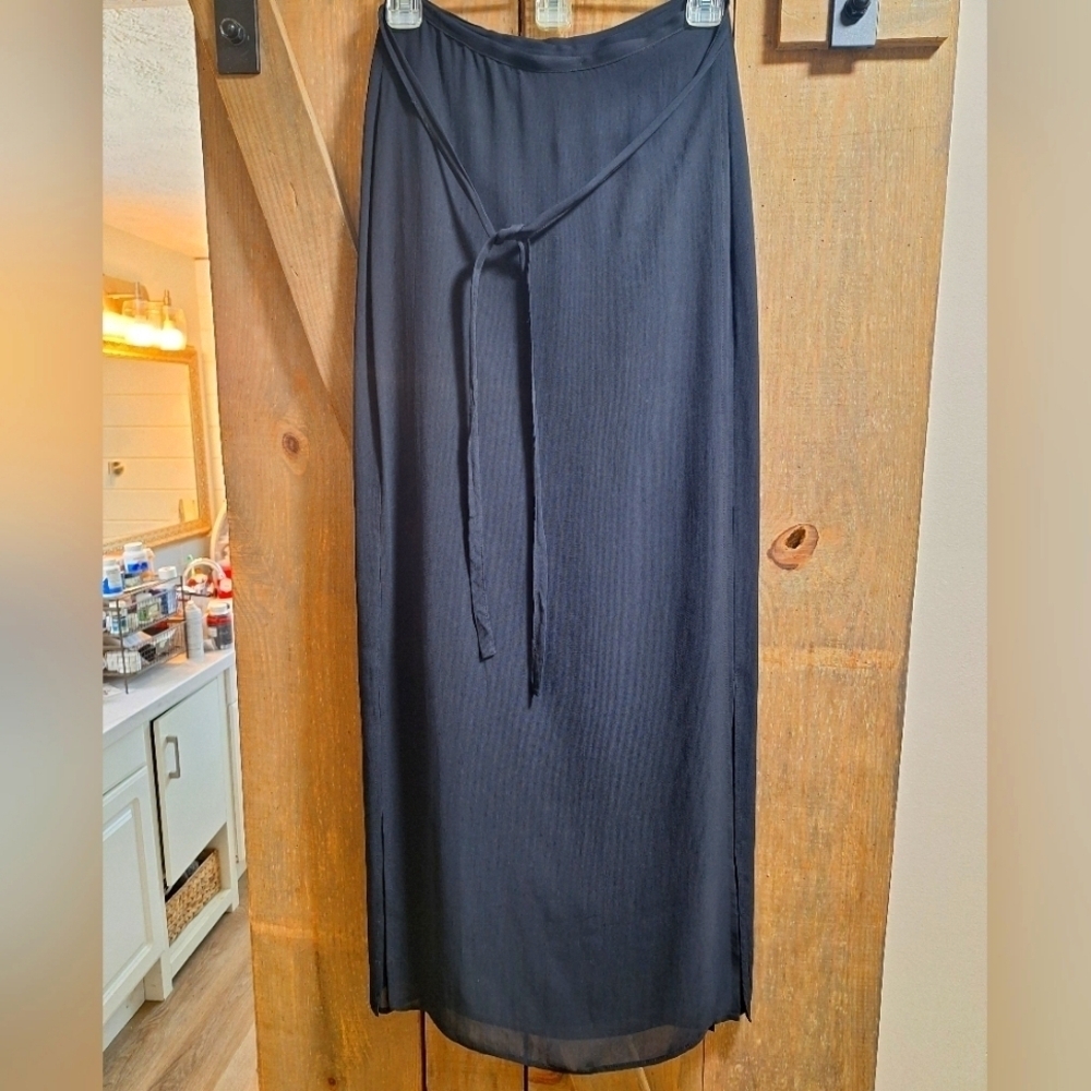 A vintage Zara maxi length black split hem pencil skirt in a size 6. EUC.